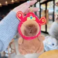 Cute capybara plush keychain, soft stuffed animal bag charm with traditional red hat. - God of Wealth Hat