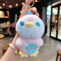 Cute pink penguin plush keychain with blue star bag accessory, soft fluffy toy pendant. - Pink