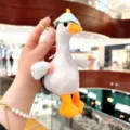 Detailed view of the cute white plush duck keychain with a green hat and metal ring. - Plush Schoolbag Big White Goose / Blue