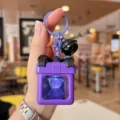 Llavero de oso luminoso morado colgante caja de regalo con lazo negro para accesorio de bolso. - Espejo Caja de Regalo / Púrpura