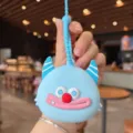 Süßer Cartoon Monster Silikon Münzgeldbörsen Schlüsselanhänger, tragbarer Kopfhörerbeutel Anhänger. - Blau