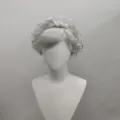 Short silver curly wig displayed on a mannequin head, ideal for cosplay and daily fashion wear. - Gray