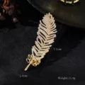 Golden feather rhinestone brooch detail, featuring exquisite crystal inlay and clear sizing info. - Luxury Pave Rhinestone Gold Feather Long Style (XD822001)