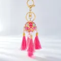 Gold alloy rhinestone embroidered ball bag charm with pink tassels for car keys detail. - Pink Hydrangea