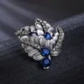 Vintage alliage bleu cristal strass broche épingle pour femmes élégant feuille corsage accessoire. - Style Feuille de Plume de Cristal Bleu Foncé (XD825227)