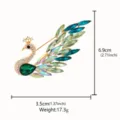 Detailed view of a gorgeous peacock brooch featuring gradient crystal and rhinestones. - Peacock Style (XD825105)