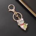 Delizioso portachiavi gatto portafortuna in strass, ciondolo borsa lega dorata chic. - Oro, Gatto della Fortuna Rosa