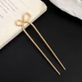 Minimalist gold U-shaped bow hairpin for chic daily updos and elegant modern styling. - Gold Bow Style