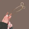 Golden U-shaped hair pin with a cute bow design, elegant metal hair fork for daily bun styling. - Gold Bow Style