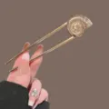 Gold U-shaped hair pin with a chic shell top design, perfect for elegant bun hairstyles. - Gold Conch Style