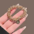 Kristalen haarelastiek champagne bruin strass haarband elastische paardenstaartouder haaraccessoire - Champagne