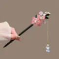 Chinese style wooden hair stick with pink floral decorations and hanging tassel design for women. - Pink Peach Blossom Green Leaf Tassel Style