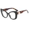 Overgrote cat-eye modebril met zwart montuur, schildpadkleurige pootjes en pareldecoratie. - Zwart Montuur Luipaard Pootjes Transparante Glazen