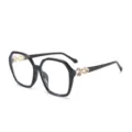 Chic occhiali da sole poligonali da donna, elegante montatura nera con dettagli dorati. - C1 Montatura Nera