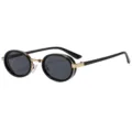 Lunettes de soleil ovales vintage avec monture noire élégante et accents en métal doré. - C3 Cadre Or Noir Verre Gris