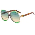 Occhiali da sole ovali oversize con montatura dorata e aste tartarugate per donna. - C2 Montatura Verde Lente Tè Verde Sfumato