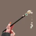 Elegant Chinese style wooden hairpin with pearl tassels, perfect match for Hanfu and qipao. - White Jade Ring Plum Blossom Branch Tassel Wooden Hairpin