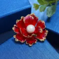 Exquisite red peony flower brooch with a central white pearl and gold trim. Detail view. - Rich Red (White Pearl)