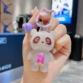 Cute luminous panda keychain detail shot, glowing acrylic bag pendant with cute bear charm. - Gray