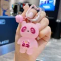 Detailed shot of cute pink glowing panda keychain and bag pendant with bell, sweet style. - Pink