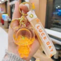 Cute acrylic liquid quicksand bear keychain charm for car keys, backpack pendant. - Orange