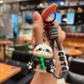Cute cartoon panda keychain with bamboo design, perfect bag charm and stylish car key accessory. - Electroplated Panda - Holding Bamboo