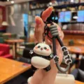 Cute cartoon panda keychain accessory, perfect for bags and car keys. High quality finish. - Electroplated Panda - Hug