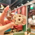 Cute capybara projection camera keychain with bell, detailed view of backpack pendant. - Capybara Camera - Stacking