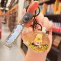 Cute acrylic liquid floating capybara keychain bag charm, clear dynamic glitter pendant accessory - Yellow Airplane Capybara Style / Yellow