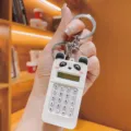 Detailed close-up of a cute panda mini calculator keychain, portable backpack pendant in white. - White