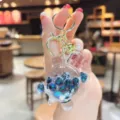Simpatico portachiavi tartaruga trasparente pieno d'olio con bellissime paillettes lucide. - Perle Luminose—Nero