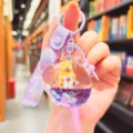 Cute quicksand acrylic floating airplane capybara keychain for girls bag and phone charm. - Purple Airplane Capybara Style / Purple