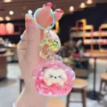 Close-up detail of the pink quicksand glitter dumpling keychain accessory with metal ring. - Rose Red