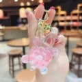 Cute liquid glitter turtle keychain, close-up view of the glowing shell charm pendant bag accessory. - Luminous Beads—Red