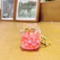 Cute liquid quicksand acrylic beaded lucky cat keychain charm for stylish bags and keys detail - Beads-Red