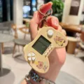 Cute capybara game console keychain, mini portable electronic toy bag pendant for gifts. - Gamepad Style—Yellow Car