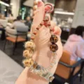 Leopard print beaded phone charm keychain cute beaded bag pendant strap accessories for women. - Three Plush Pompoms Leopard Style