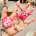 Süßer rosa Perlen Schlüsselanhänger mit Ballonhund Anhänger für Damen und Mädchen Mode. - Roter Hund