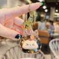 Simpatico Kiki Portachiavi Sabbia Mobile Cartone Animato Borsa Ciondolo Glitter Regalo - Scintillante - Oro Nero