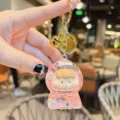 Cute liquid quicksand keychain, pink epoxy floating glitter charm with golden ring and bell. - Glitter Pink