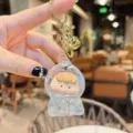 Cute liquid quicksand astronaut keychain transparent capsule cartoon doll bag charm pendant. - Glitter White