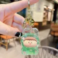 Cute acrylic quicksand keychain pendant, green cartoon character charm for bags and keys. - Green