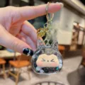 Portachiavi con sabbia mobile liquida carina con orecchie di gatto e perline glitterate. - Perle-Nero