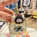 Cute cartoon quicksand flash KIKI bear keychain, sparkling liquid bag pendant for daily use. - Black