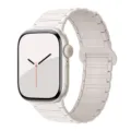 Close-up detail view of magnetic silicone watch band compatible with Apple Watch. - Light Peach Pink with Starlight
