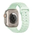 Close-up detail of the mint green silicone watch band and titanium case back design. - Triple Bead Silicone / 38/40/41/Gen10-12 42MM Universal