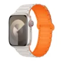 Silicone magnetic watch strap detail, orange and white segmented design close up view - Starlight Orange