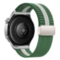 Detailed view of the back sensor and magnetic folding clasp on the striped woven nylon watch strap. - 22mm / Green and White Striped