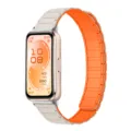Detalle de correa de reloj magnética de silicona, repuesto en colores naranja y gris. - Blanco estelar y naranja