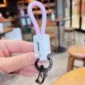 Geflochtener PU-Leder-Schlüsselanhänger mit rosa Seil und schwarzen Metallbeschlägen. - Hellrosa